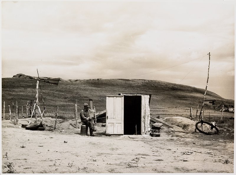 Many farmers are abandoning their homes and moving into dugouts near towns, to become eligible for drought relief. Grassy Butte, North Dakota, Arthur Rothstein, July 1936