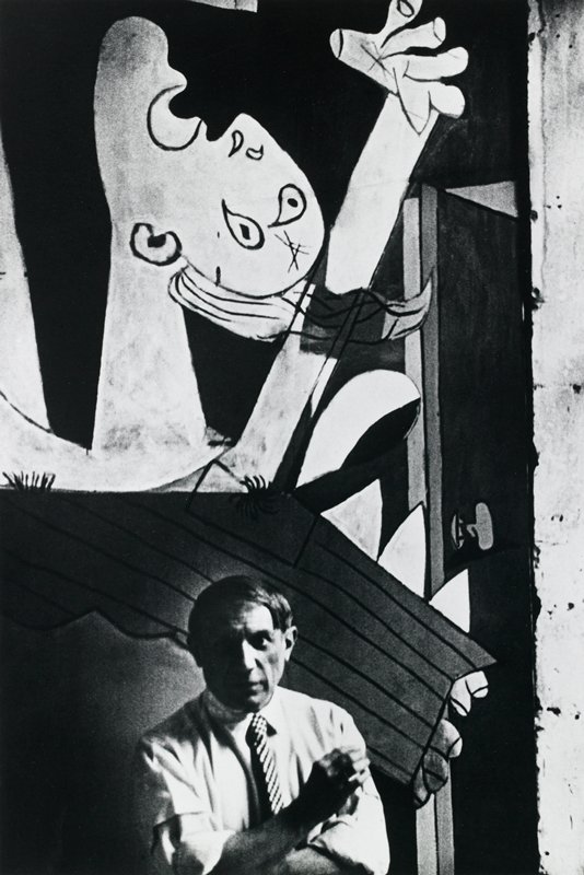 Pablo Picasso and detail of Guernica, France, David Seymour, 1937