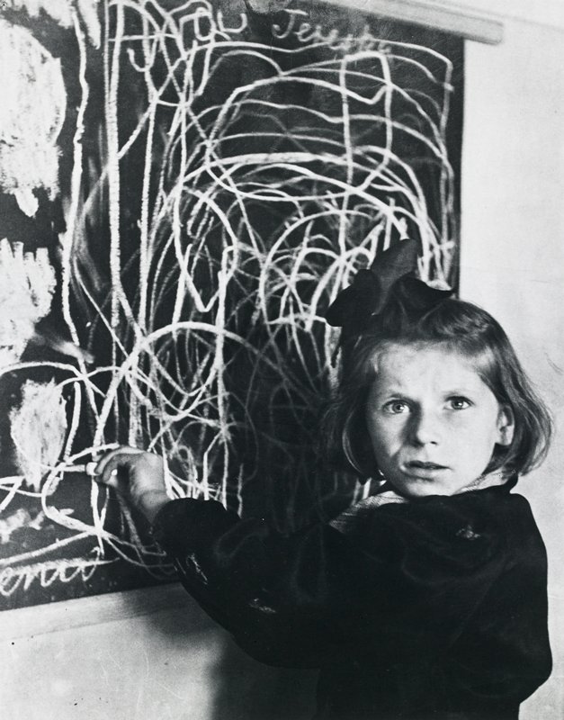 Terezka, a disturbed child in an orphanage. The scrawl on the blackboard is her drawing of 'home'. Poland., David Seymour, 1948 (printed 1982)