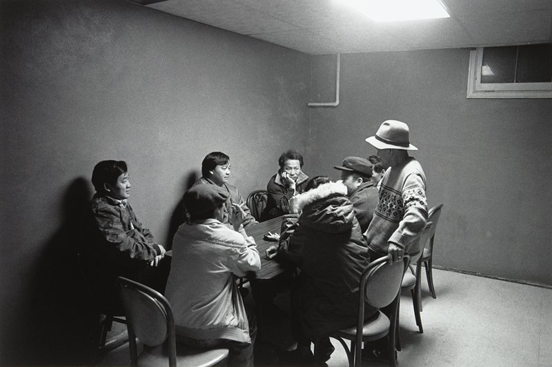 Hmong Men in Hmong Funeral Home Basement, Frogtown, Wing Young Huie, 1994