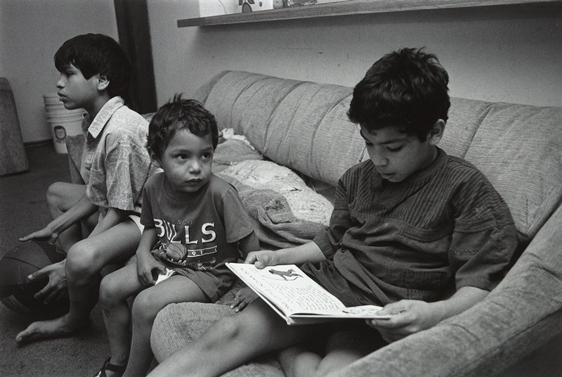 Boy Reading, Frogtown, Wing Young Huie, 1994