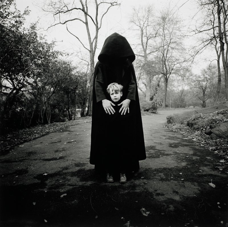 Young Boy and Hooded Figure, N.Y., Arthur Tress, 1971