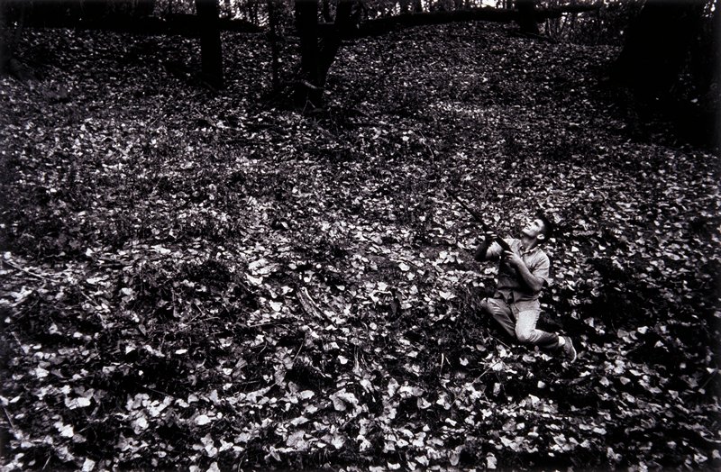 Untitled (man with gun in leaves), Larry Clark, 1963