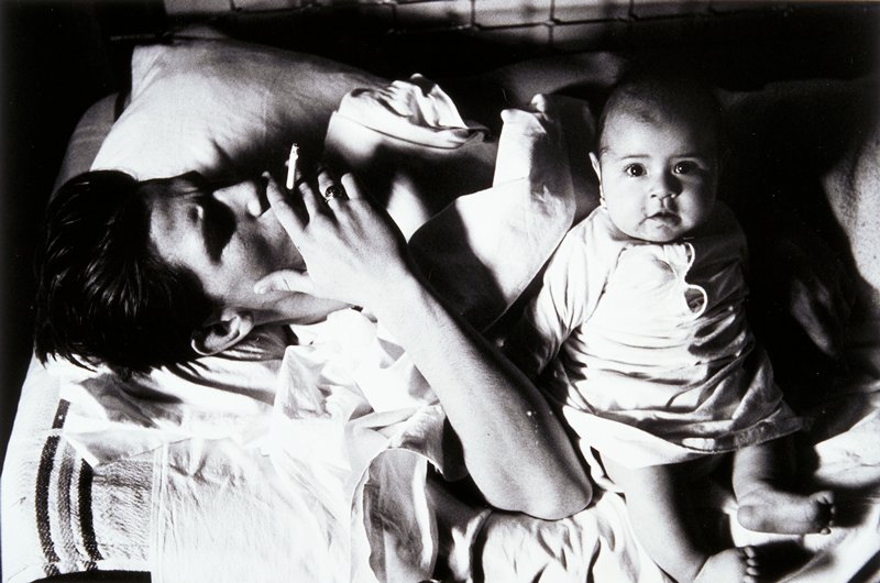 Untitled (smoking man with baby), Larry Clark, 1963
