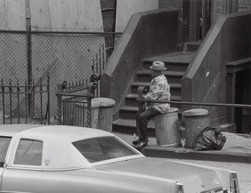 Man Smoking Cigar on Ashcan, Roy DeCarava, 1978