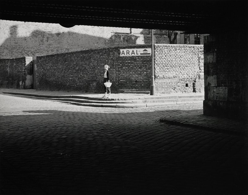 Untitled (woman on corner in sun), Robert Gene Wilcox, 20th century