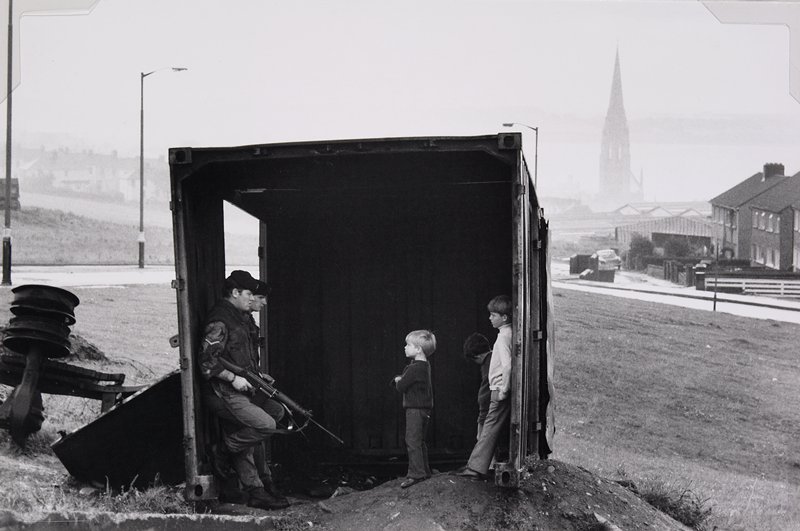 Untitled [two armed soldiers and three small children in shed], Philip Jones Griffiths, 20th-21st century