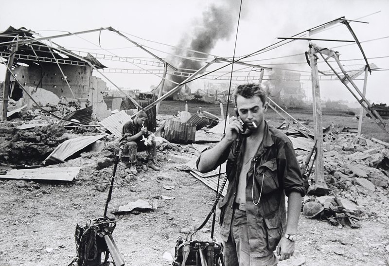 Saigon Under Attack: Exhausted Americans in burned-out ruin, on the outskirts of Saigon, where elements of the 199th Light Infantry Brigade were fighting the Vietcong, Philip Jones Griffiths, 20th century