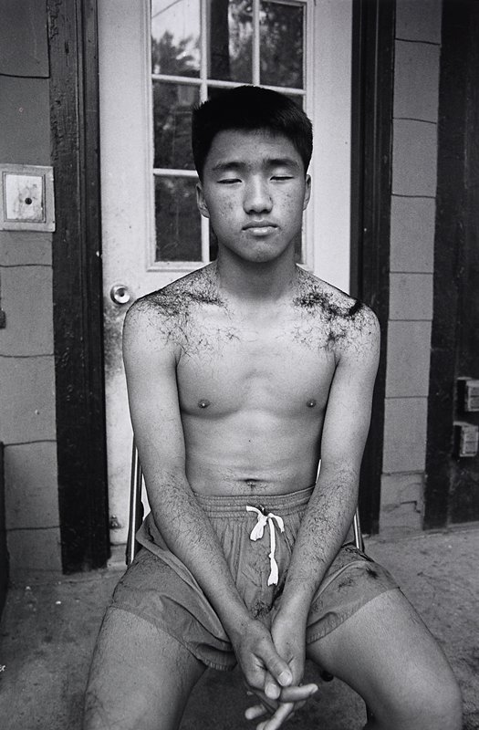 Hmong Teenager Getting a Haircut, Frogtown, Wing Young Huie, 1994