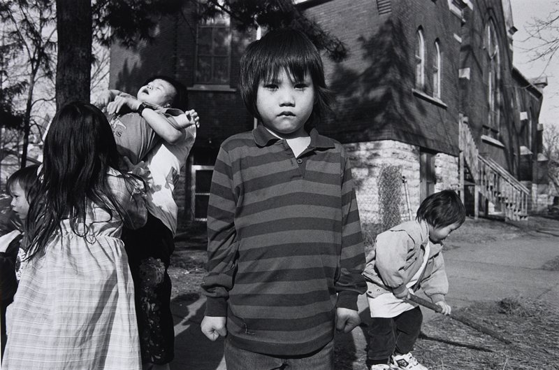 Hmong Boy with Clenched Fists, Frogtown, Wing Young Huie, 1994