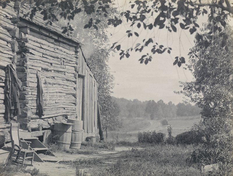 Untitled [log cabin, chair, barrels and trees], Theodore Eitel, c. 1915