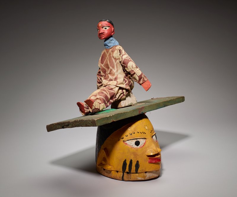 Gelede mask with puppet, c. 2000