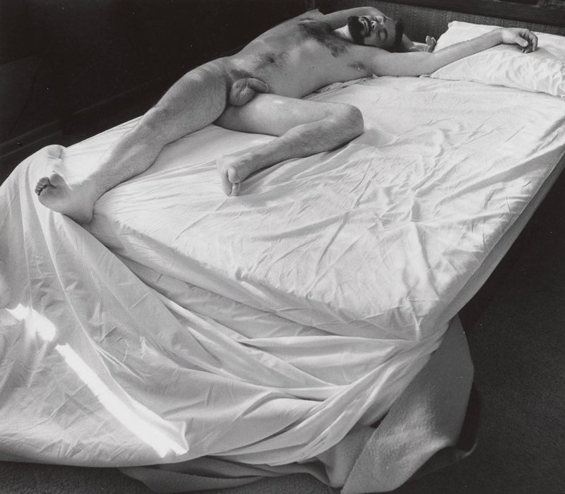 [Nude man lying on bed], Joanne Leonard, 20th century