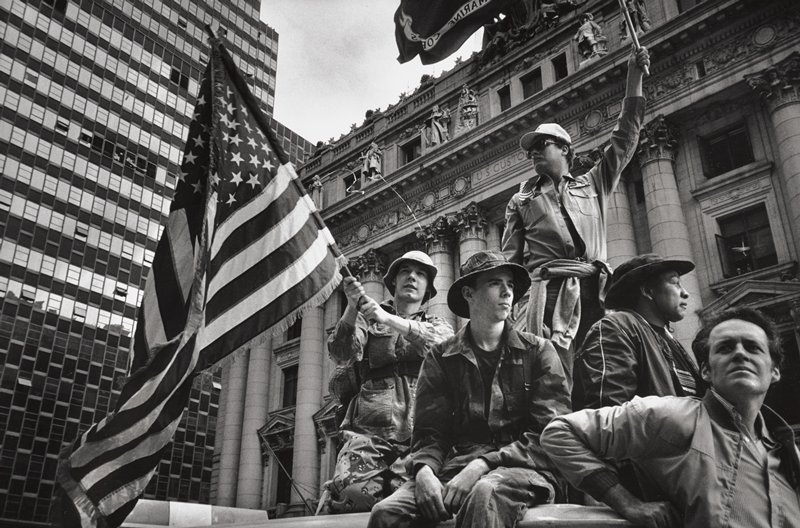 Marine raising flag in front of U.S. Customs House, New York, Ken Heyman, 1985 (printed 1995)