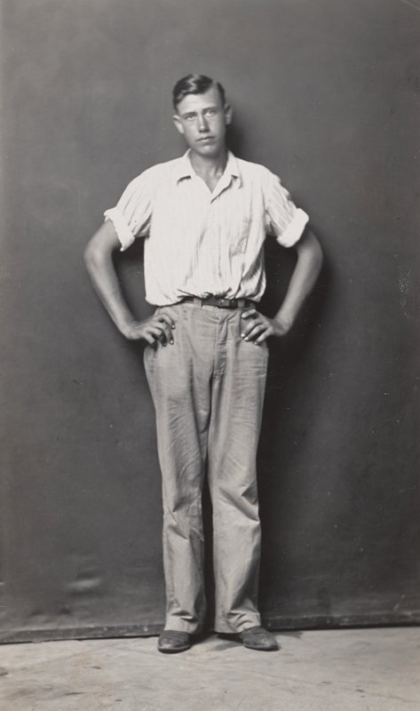 Standing man, arms akimbo by Mike Disfarmer