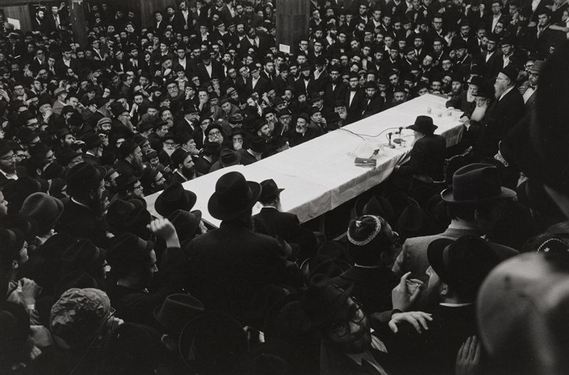 A New York Rabbi speaking to an all male congregation in a Brooklyn Synagogue during a Verbringen meeting, Willamsburg, NY, Leonard Freed, 1954
