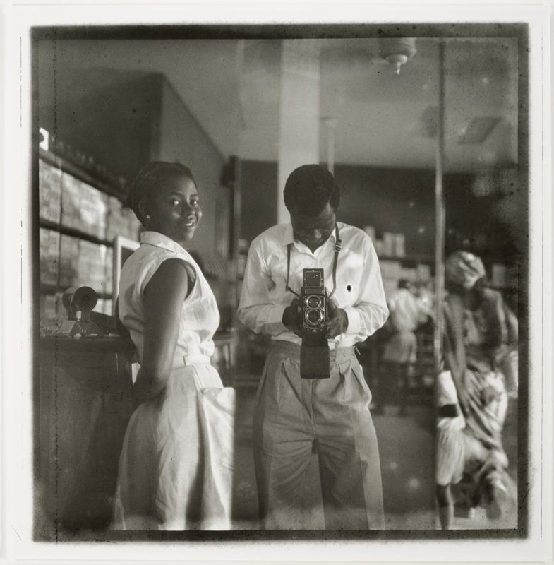 Self-portrait with a store assistant at the West African Drug Company, James Barnor, 1952 (printed 2023)