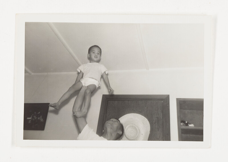 [Man lifting a child overhead], c. 1965