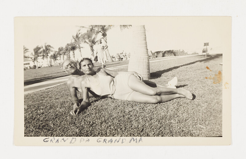 [Older couple reclining on grass], c. 1955