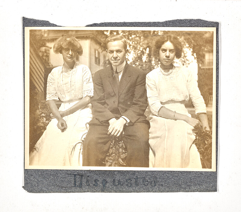 [Three people sitting outdoors], c. 1920