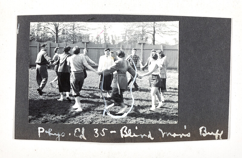 [Students playing game outdoors in circle formation], 1940–50