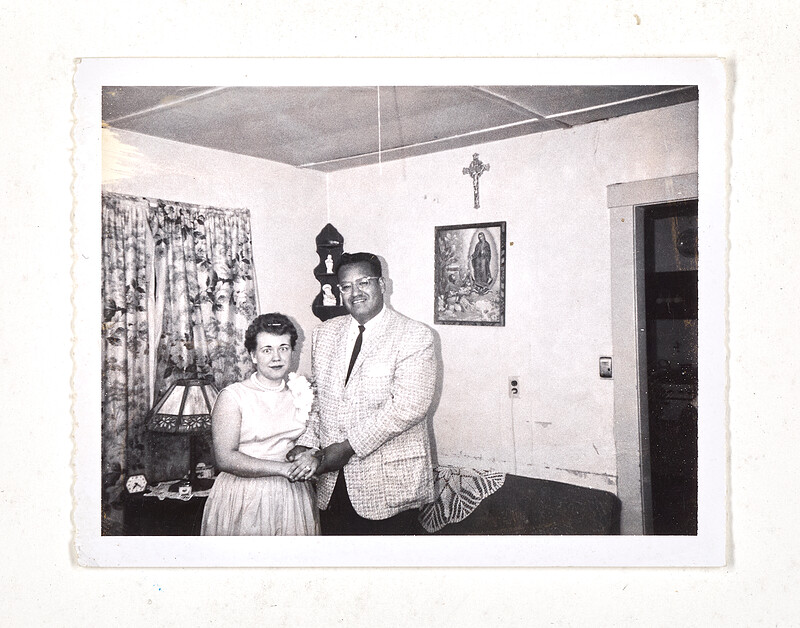 [Couple posing in interior with religious decor], c. 1960