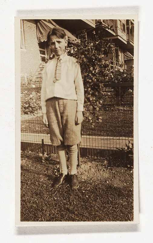 [Boy standing in yard], c. 1920