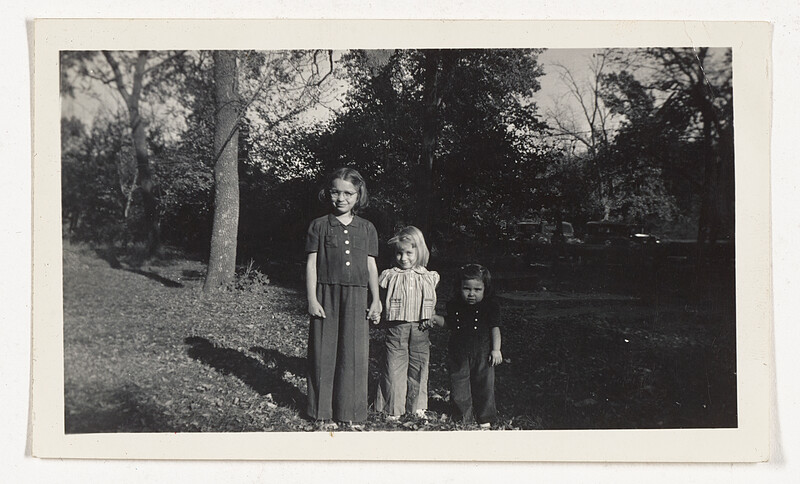 [Three children standing outdoors], c. 1940–50
